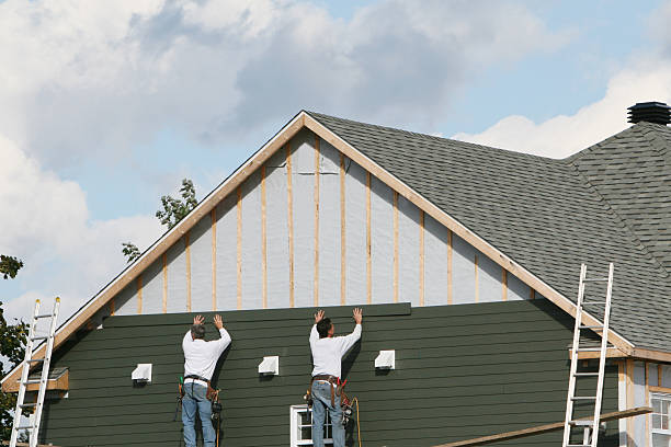 Professional Storm Damage Siding Repair technician working in Hudson, NC